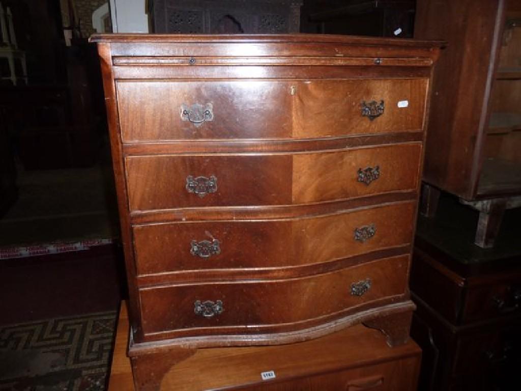 Appraisal: A reproduction mahogany bachelors chest in the Georgian style the