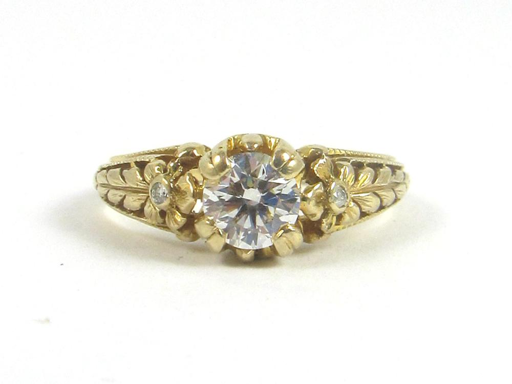 Appraisal: LADY'S DIAMOND AND FOURTEEN KARAT GOLD RING centering a single