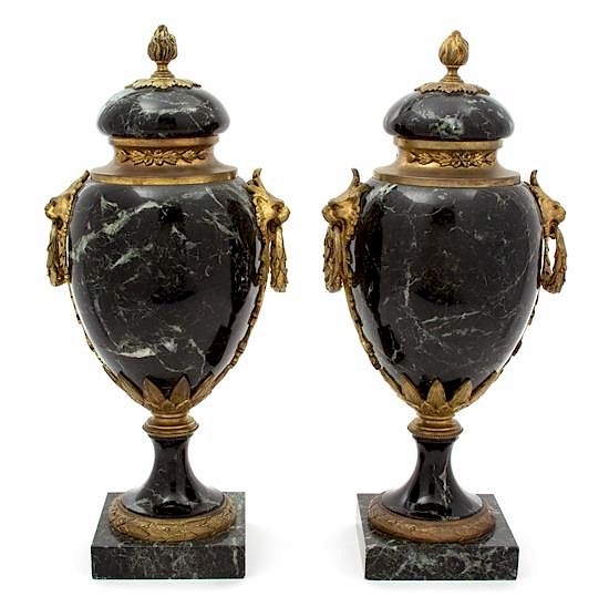 Appraisal: A Pair of French Black Marble Urns with Gilt Metal