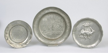 Appraisal: A Group of Three Pewter Chargers Containing a small plate