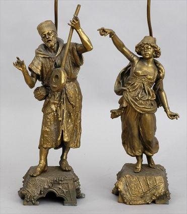 Appraisal: PAIR OF GILT-METAL FIGURES OF ARABS MOUNTED AS LAMPS Modeled