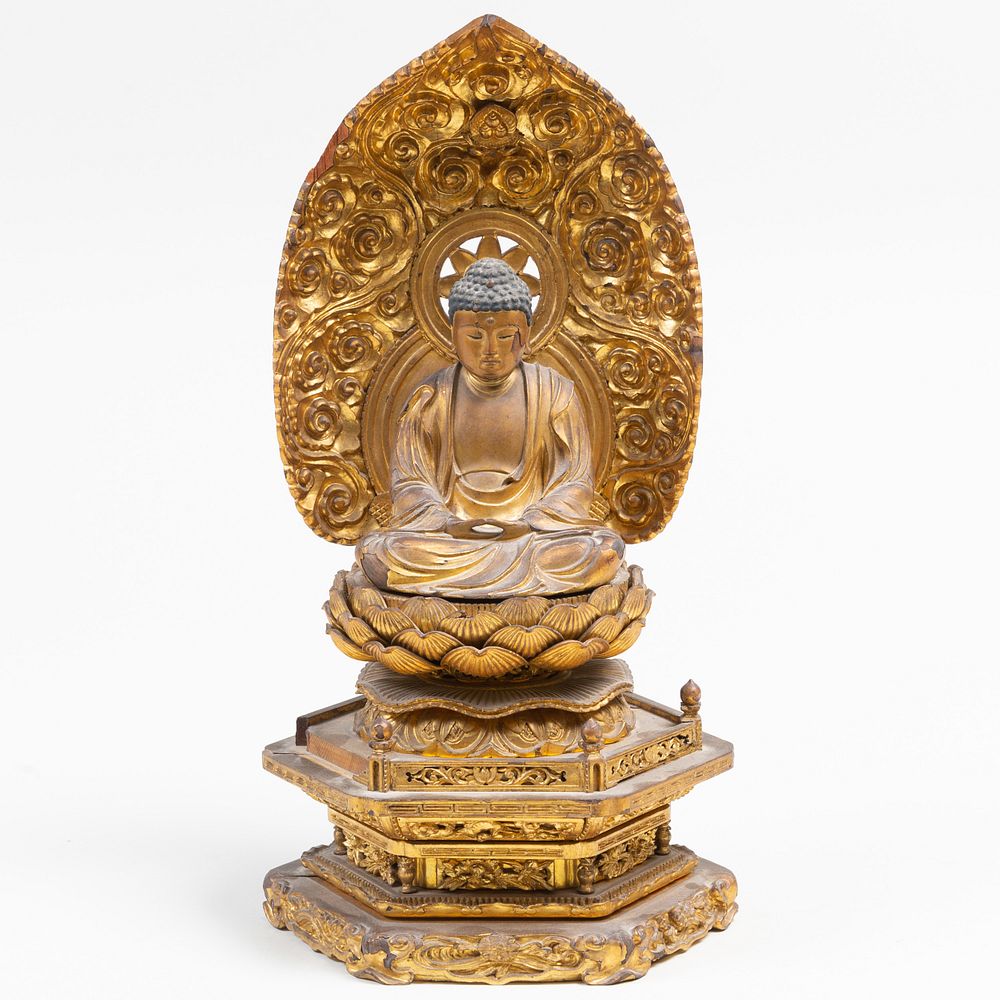 Appraisal: Chinese Gilt-Laquered Seated Buddha on Stand The figure in high