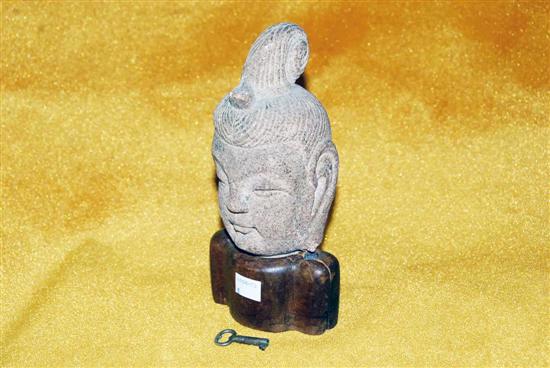 Appraisal: ANTIQUE CARVED STONE BUDDHA HEAD On as is custom stand