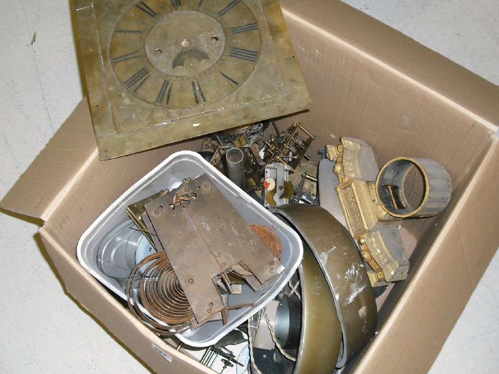 Appraisal: Box of general clock spares including movements dials chases etc