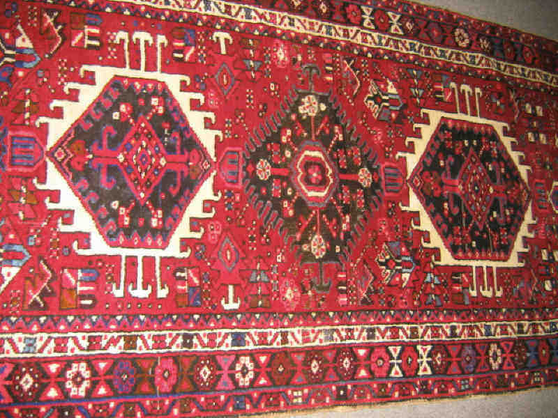 Appraisal: KARAJA LONG RUG The brick red field of geometric floral