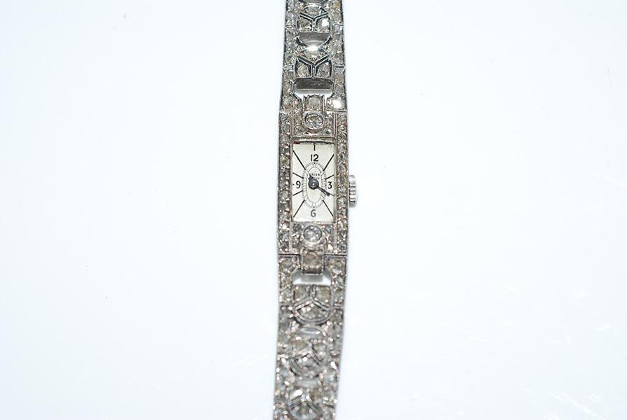 Appraisal: AN ART DECO DIAMOND COCKTAIL WRISTWATCH IN SILVER AN ART