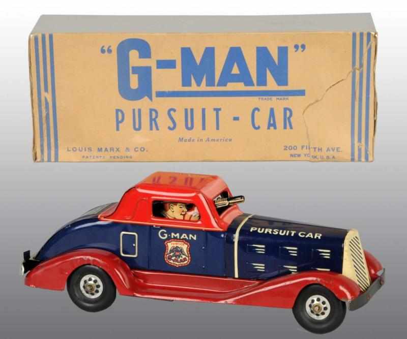 Appraisal: Pressed Steel Marx G-Man Pursuit-Car Wind-Up Toy Description American Needs