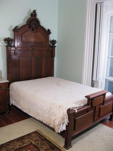 Appraisal: Victorian Renaissance Revival Bed American ca walnut with applied carvings