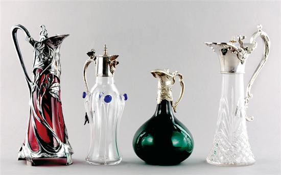 Appraisal: Silverplate and glass decanters Art Nouveau style with red glass