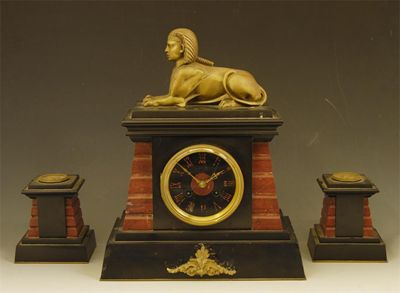 Appraisal: A French marble and brass clock garniture the eight day