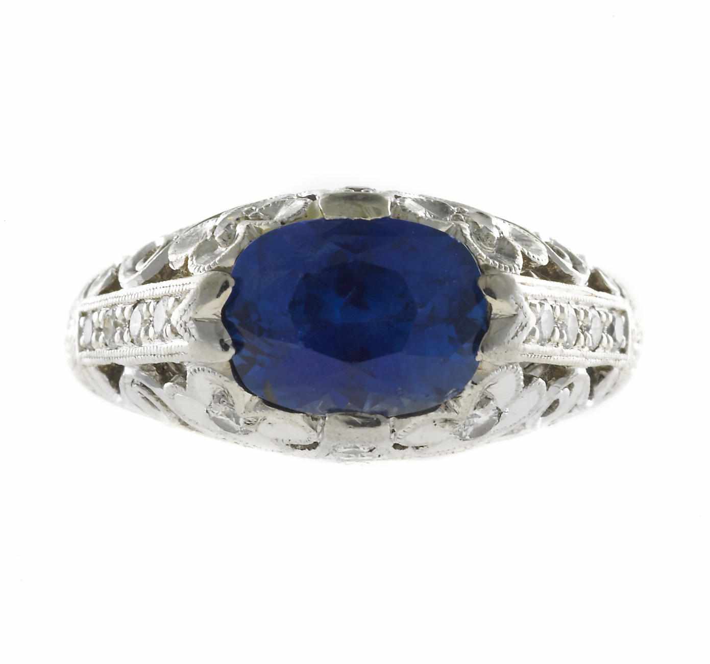 Appraisal: A sapphire and diamond filigree ring cushion-cut sapphire weighing approximately