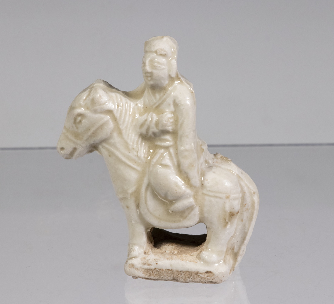 Appraisal: MINIATURE SONG QINBAI FIGURE OF A HORSEMAN Molded white clay