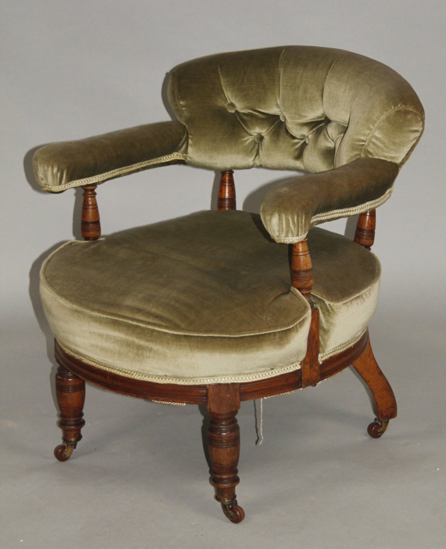 Appraisal: A late thC tub chair with button back and circular