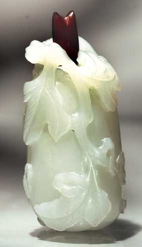 Appraisal: ANTIQUE WHITE JADE SNUFF BOTTLE Well hollowed and antique carved