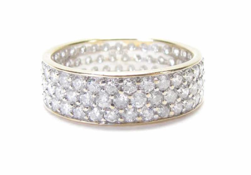 Appraisal: A K white gold band with yellow gold accent pave