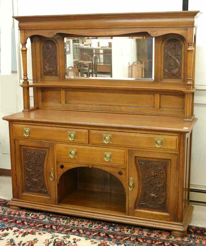 Appraisal: CARVED OAK SIDEBOARD English c in two sections top mirror-panel