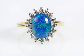 Appraisal: Opal triplet diamond yellow and white gold ring Opal triplet