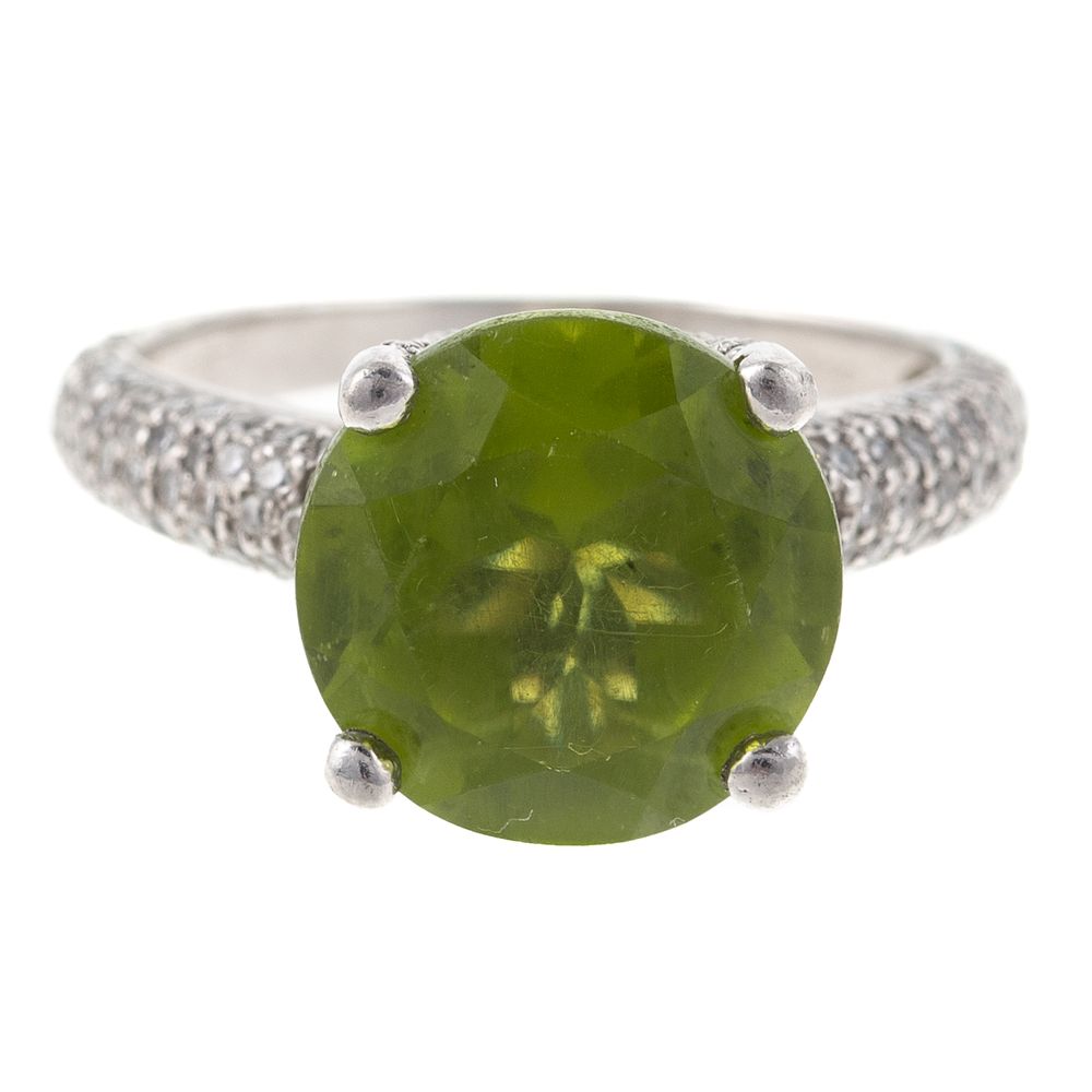 Appraisal: A Platinum Peridot Diamond Ring Platinum ring with round peridot