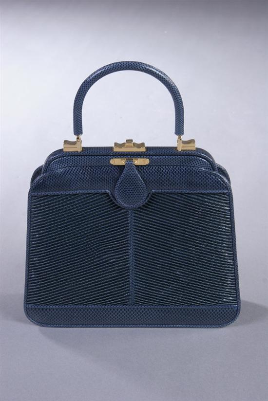 Appraisal: JUDITH LEIBER NAVY SNAKESKIN HANDBAG Gold tone clasp Together with