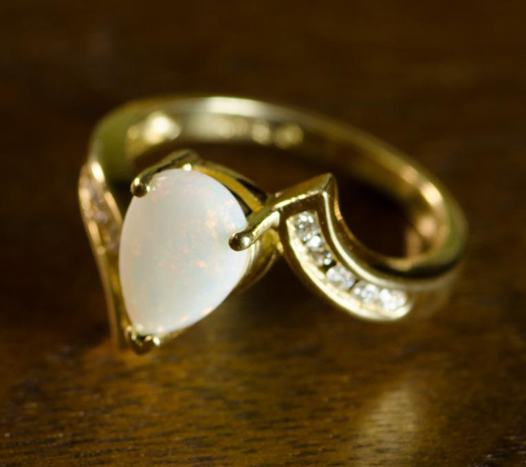 Appraisal: OPAL DIAMOND AND FOURTEEN KARAT GOLD RING with five round-cut