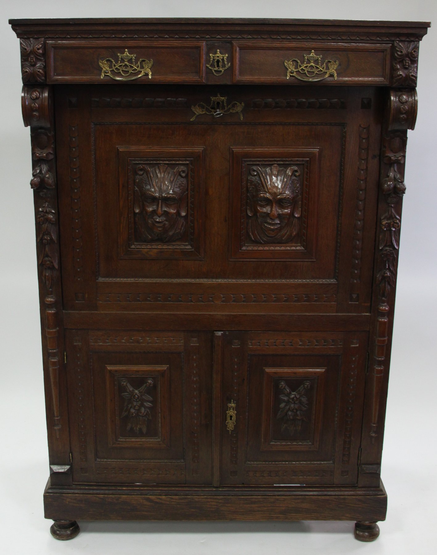 Appraisal: A Victorian oak escritoire fitted a frieze drawer above the