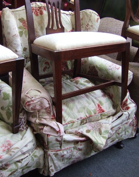 Appraisal: A th century mahogany framed wing armchair resting on cabriole