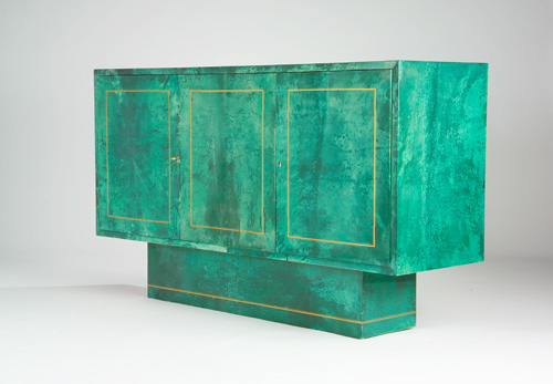 Appraisal: ALDO TURA Fine three-door buffet entirely covered in dyed-green parchment