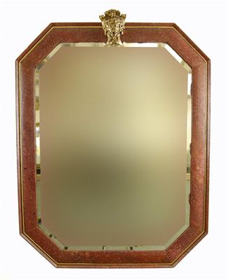 Appraisal: A simulated porphyry octaganal mirror with later applied brass lion