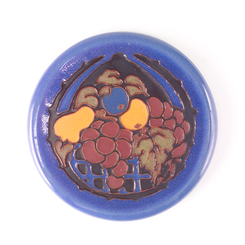 Appraisal: CALIFORNIA FAIENCE Circular trivet decorated in cuenca with a basket