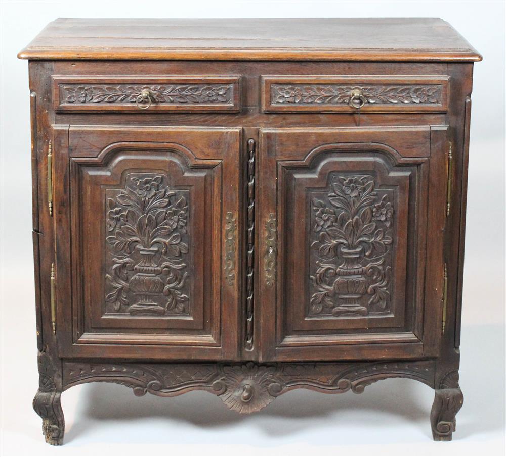 Appraisal: FRENCH PROVINCIAL OAK BUFFET with arched foliate carved doors -