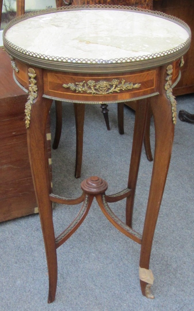 Appraisal: A late th century French gilt metal mounted mahogany marble