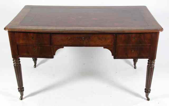 Appraisal: A late Georgian writing desk with leather inset top above