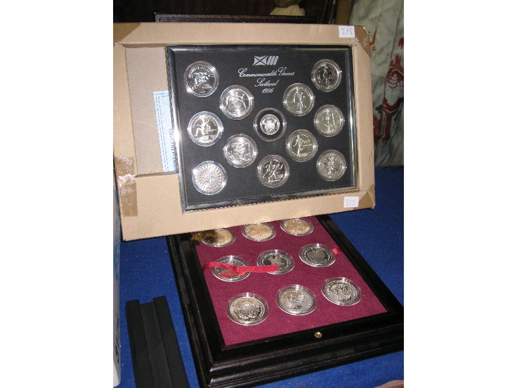 Appraisal: Lot comprising two commemorative sets of coins