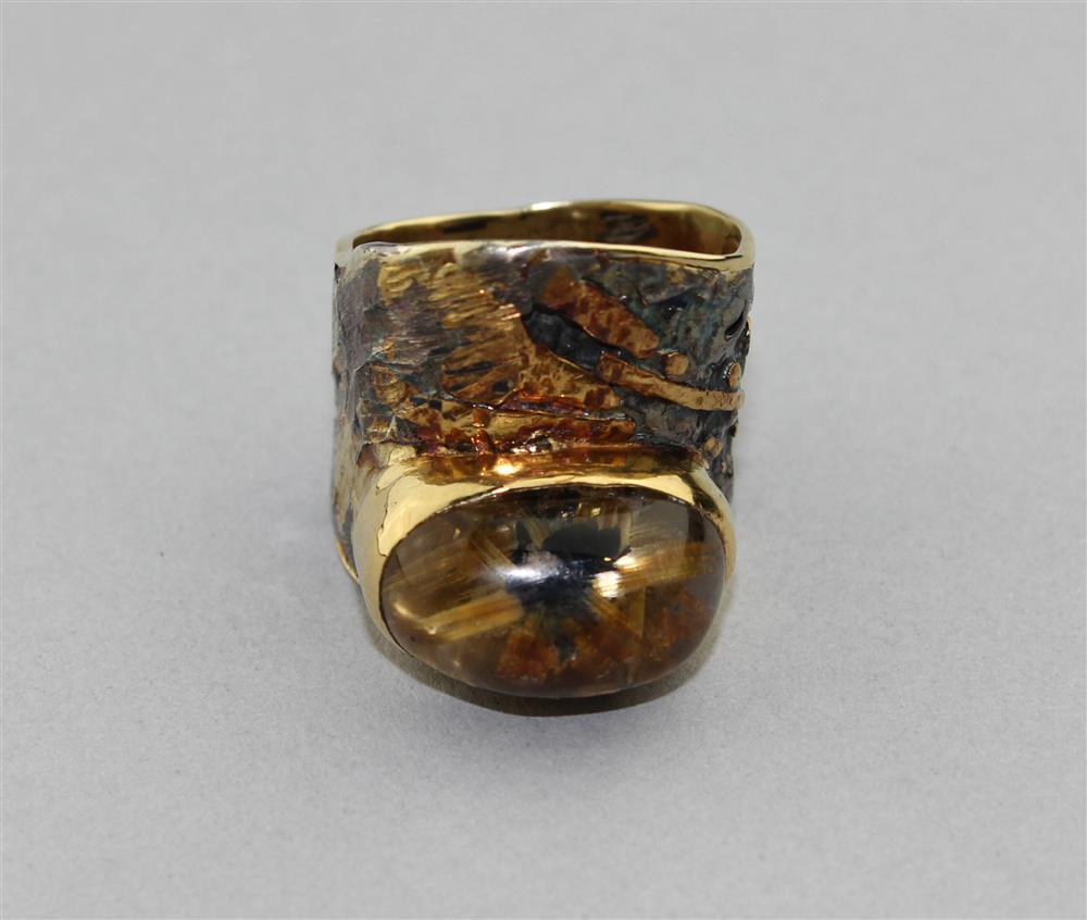 Appraisal: MARNE RYAN GEOSCAPE RING the high dome cabochon is rutilated