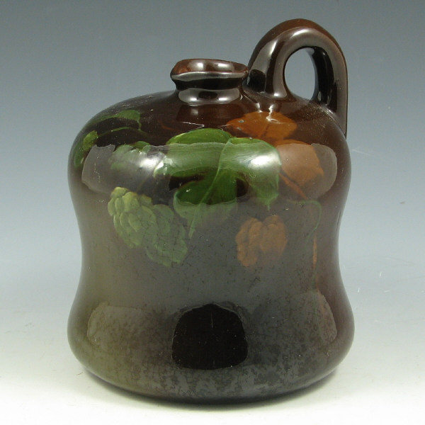 Appraisal: Weller Louwelsa jug with berry decoration under standard glaze Illegibly