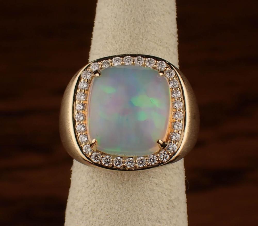 Appraisal: OPAL DIAMOND AND FOURTEEN KARAT GOLD RING The heavy satin