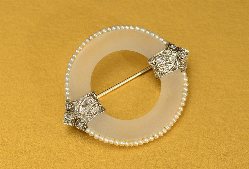 Appraisal: FROSTED ROCK CRYSTAL QUARTZ CIRCLE PIN Platinum mounting accented with