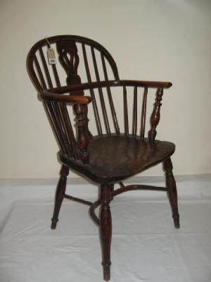 Appraisal: A YEW WINDSOR ARM CHAIR by Nicholson Rockley of low