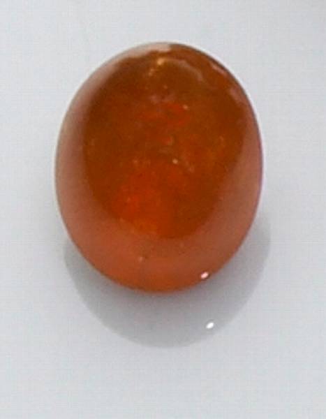 Appraisal: Spessartite Garnet Nigeria A pretty oval cabochon of bright orange