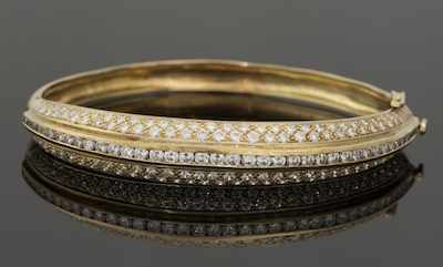 Appraisal: A Ladies' Diamond Bangle Bracelet k yellow gold hinged bangle