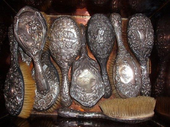 Appraisal: A collection of silver backed brushes mainly with embossed decoration