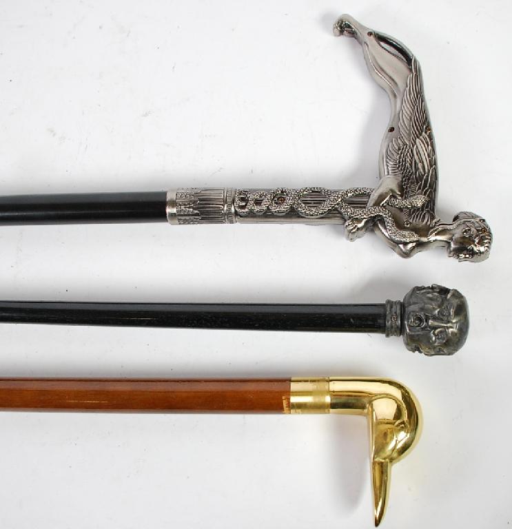 Appraisal: MALACCA WALKING CANE the metal knob handle embossed with four