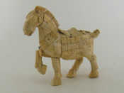 Appraisal: A Chinese bone model of a horse one foreleg raised