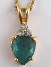 Appraisal: A yellow metal tests carat gold emerald and diamond pendant