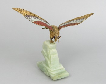 Appraisal: A Gilt and Enamel Silverwire Hawk on a Green Jade