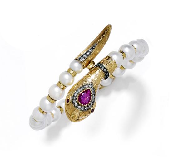 Appraisal: PEARL AND GEMSTONE BANGLE ca Yellow gold Fancy snake bangle