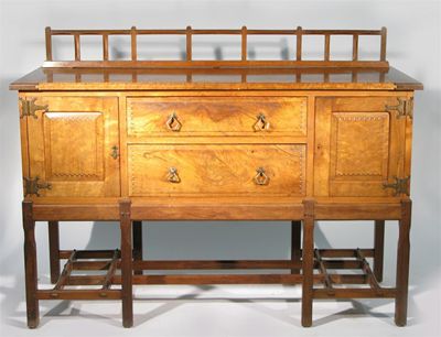 Appraisal: An Arts and Crafts Cotswold School walnut sideboard with low