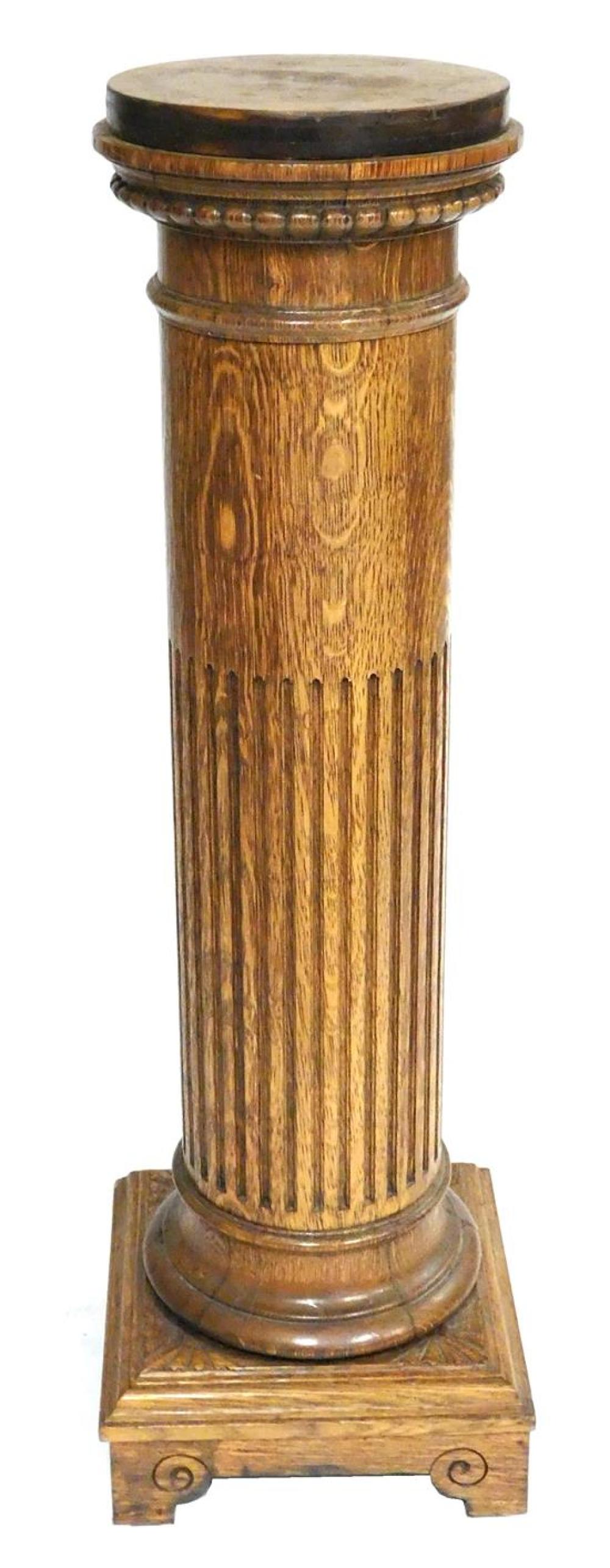 Appraisal: Display pedestal oak column form with reeding square foot wear