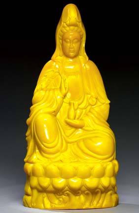 Appraisal: LARGE YELLOW GLASS GUANYIN Very unusual and large Chinese bright