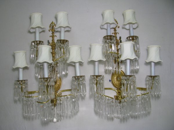 Appraisal: Pair of five arm brass wall sconces with hanging crystal